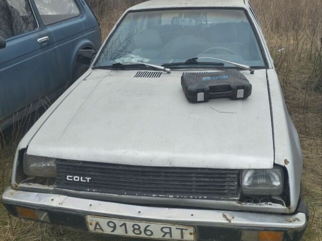 Серый Мицубиси Кольт, объемом двигателя 1.2 л и пробегом 100 тыс. км за 262 $, фото 1 на Automoto.ua