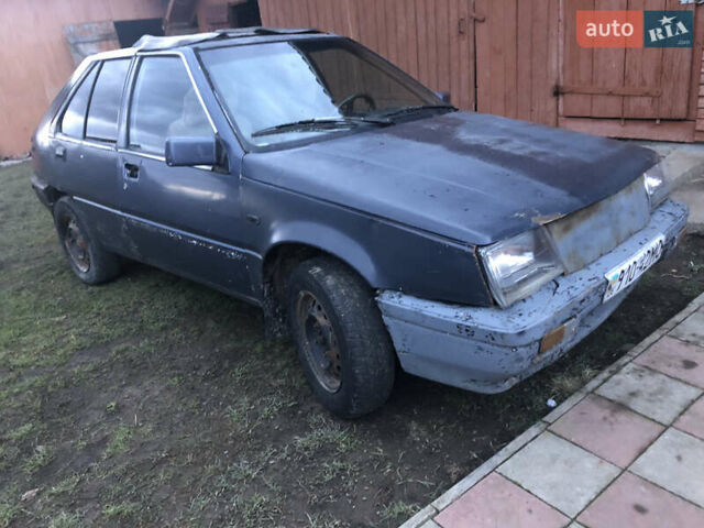 Серый Мицубиси Кольт, объемом двигателя 1.5 л и пробегом 290 тыс. км за 399 $, фото 1 на Automoto.ua