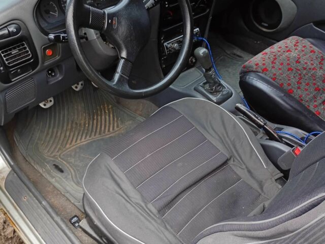 Сірий Міцубісі Кольт, об'ємом двигуна 1 л та пробігом 100 тис. км за 945 $, фото 6 на Automoto.ua