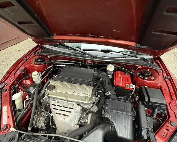 Оранжевый Мицубиси Эклипс, объемом двигателя 2.38 л и пробегом 97 тыс. км за 7500 $, фото 6 на Automoto.ua