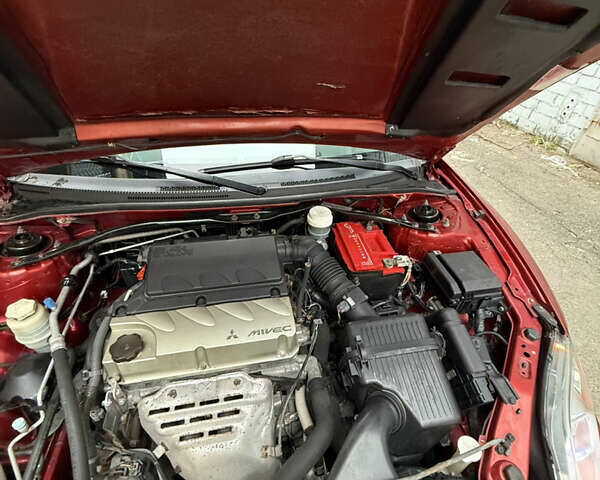 Оранжевый Мицубиси Эклипс, объемом двигателя 2.38 л и пробегом 97 тыс. км за 7500 $, фото 7 на Automoto.ua