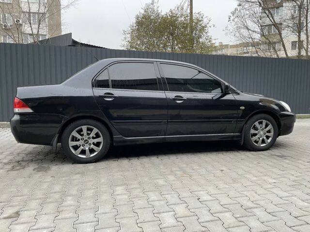 Черный Мицубиси Этерна, объемом двигателя 1.6 л и пробегом 302 тыс. км за 3900 $, фото 5 на Automoto.ua