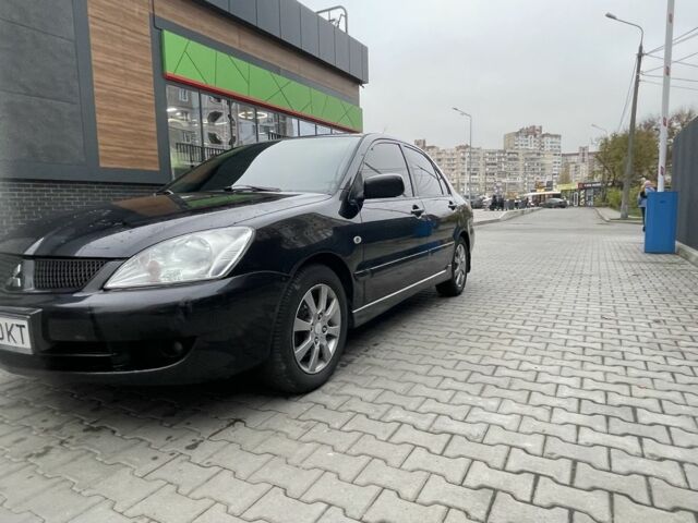 Черный Мицубиси Этерна, объемом двигателя 1.6 л и пробегом 302 тыс. км за 3900 $, фото 3 на Automoto.ua