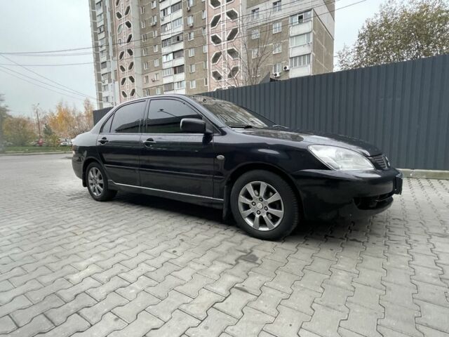 Черный Мицубиси Этерна, объемом двигателя 1.6 л и пробегом 302 тыс. км за 3900 $, фото 1 на Automoto.ua