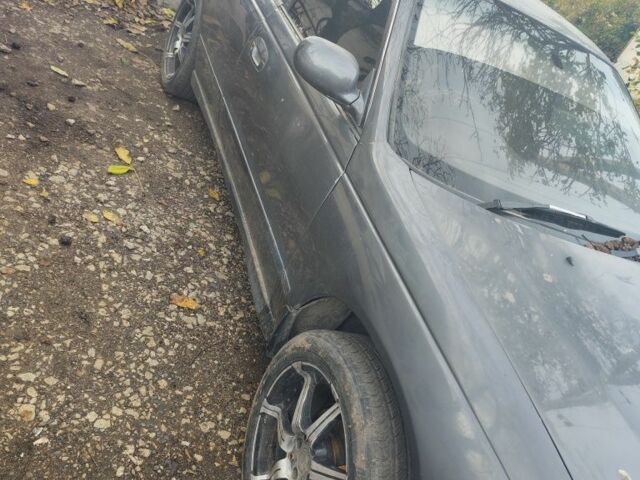 Серый Мицубиси Этерна, объемом двигателя 2 л и пробегом 172 тыс. км за 800 $, фото 1 на Automoto.ua