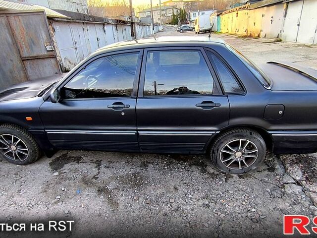 Черный Мицубиси Галант, объемом двигателя 1.8 л и пробегом 300 тыс. км за 1800 $, фото 3 на Automoto.ua