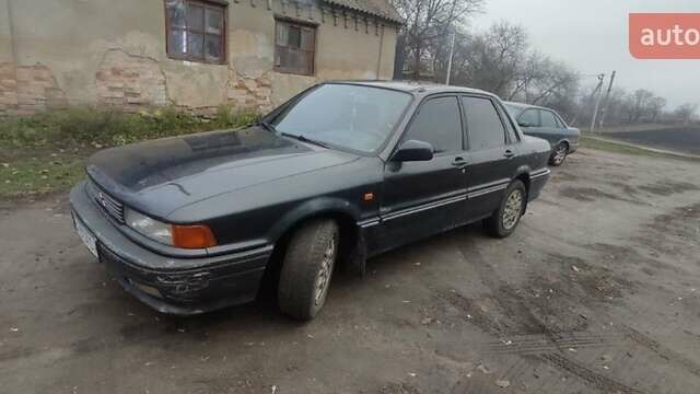 Черный Мицубиси Галант, объемом двигателя 1.8 л и пробегом 441 тыс. км за 1600 $, фото 1 на Automoto.ua