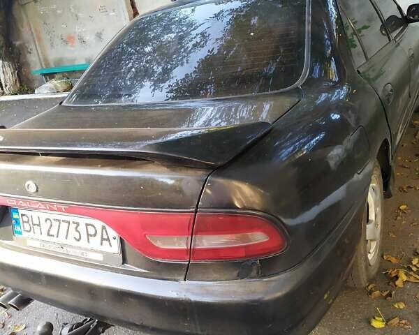 Черный Мицубиси Галант, объемом двигателя 2 л и пробегом 160 тыс. км за 3000 $, фото 1 на Automoto.ua