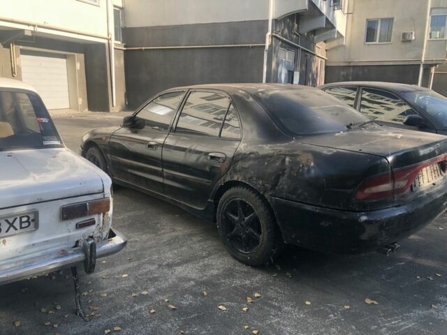 Черный Мицубиси Галант, объемом двигателя 2 л и пробегом 84 тыс. км за 900 $, фото 2 на Automoto.ua