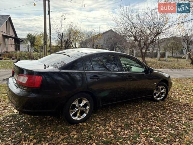 Черный Мицубиси Галант, объемом двигателя 2.4 л и пробегом 209 тыс. км за 6700 $, фото 5 на Automoto.ua