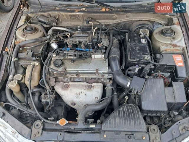 Коричневый Мицубиси Галант, объемом двигателя 2.4 л и пробегом 300 тыс. км за 3000 $, фото 14 на Automoto.ua