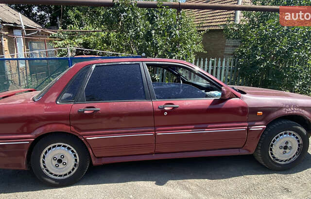 Красный Мицубиси Галант, объемом двигателя 2 л и пробегом 341 тыс. км за 1500 $, фото 2 на Automoto.ua