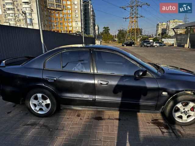 Синий Мицубиси Галант, объемом двигателя 2 л и пробегом 246 тыс. км за 3800 $, фото 2 на Automoto.ua