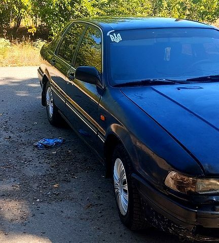 Синий Мицубиси Галант, объемом двигателя 2 л и пробегом 250 тыс. км за 650 $, фото 1 на Automoto.ua