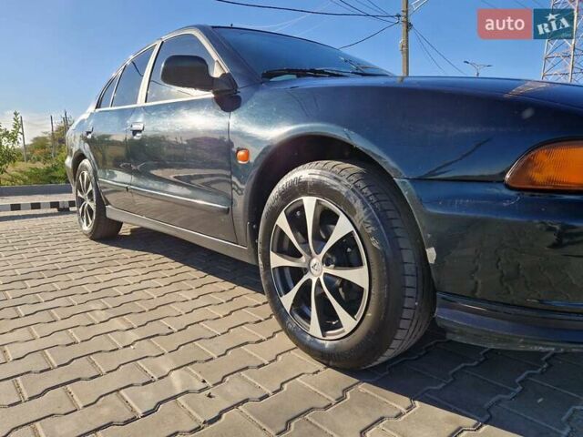 Зеленый Мицубиси Галант, объемом двигателя 2 л и пробегом 384 тыс. км за 3000 $, фото 2 на Automoto.ua