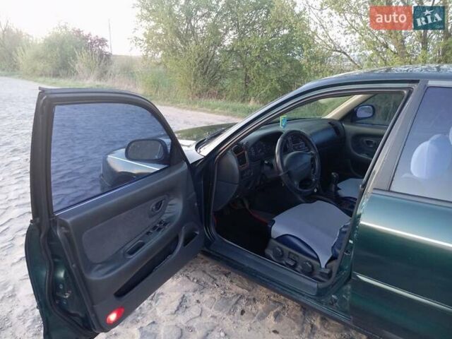 Зеленый Мицубиси Галант, объемом двигателя 2 л и пробегом 325 тыс. км за 2400 $, фото 6 на Automoto.ua