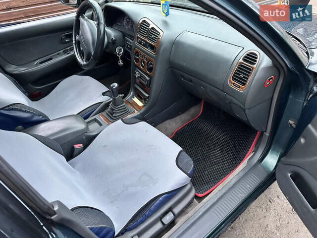 Зеленый Мицубиси Галант, объемом двигателя 2 л и пробегом 412 тыс. км за 1999 $, фото 3 на Automoto.ua