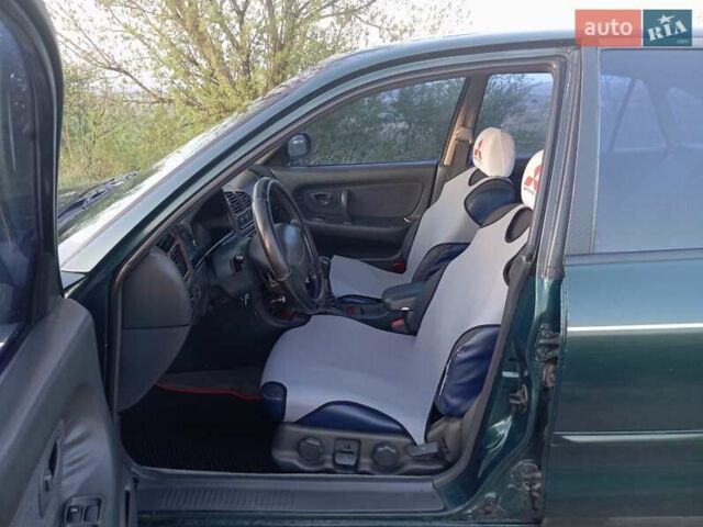 Зеленый Мицубиси Галант, объемом двигателя 2 л и пробегом 325 тыс. км за 2400 $, фото 3 на Automoto.ua