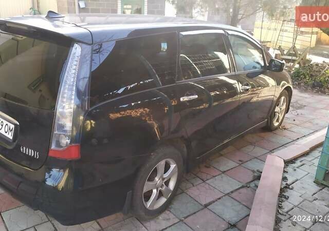 Черный Мицубиси Грандис, объемом двигателя 2.4 л и пробегом 282 тыс. км за 5400 $, фото 1 на Automoto.ua