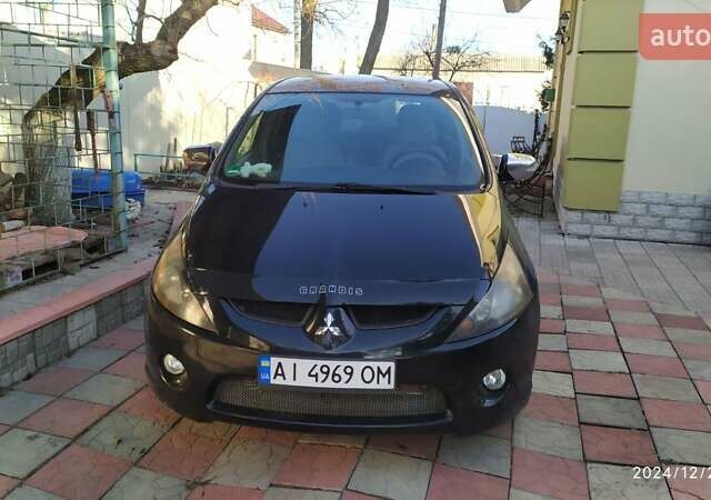Черный Мицубиси Грандис, объемом двигателя 2.4 л и пробегом 282 тыс. км за 5400 $, фото 7 на Automoto.ua