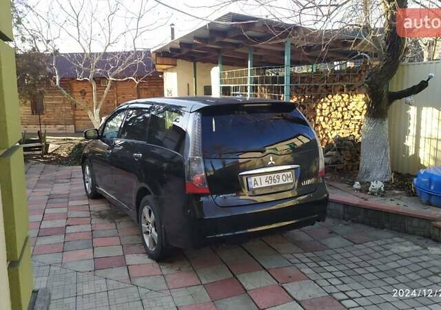 Черный Мицубиси Грандис, объемом двигателя 2.4 л и пробегом 282 тыс. км за 5400 $, фото 3 на Automoto.ua