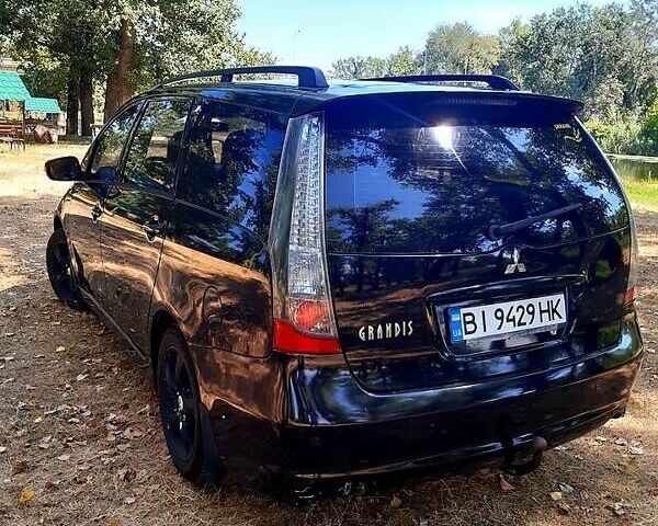 Черный Мицубиси Грандис, объемом двигателя 2.4 л и пробегом 326 тыс. км за 5500 $, фото 2 на Automoto.ua