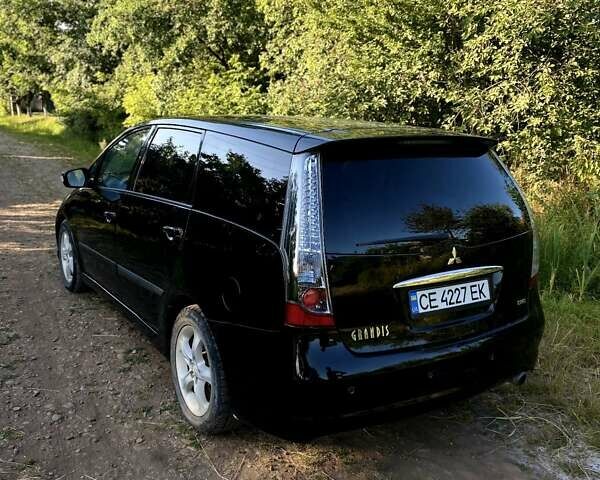 Черный Мицубиси Грандис, объемом двигателя 2 л и пробегом 300 тыс. км за 6350 $, фото 7 на Automoto.ua