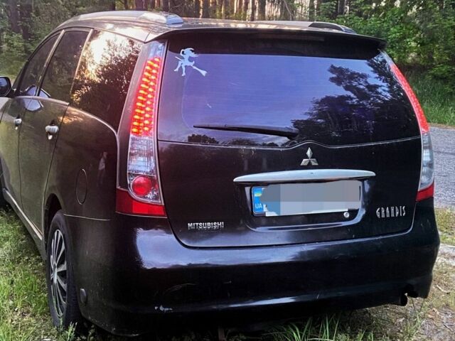 Черный Мицубиси Грандис, объемом двигателя 2.4 л и пробегом 209 тыс. км за 5500 $, фото 6 на Automoto.ua