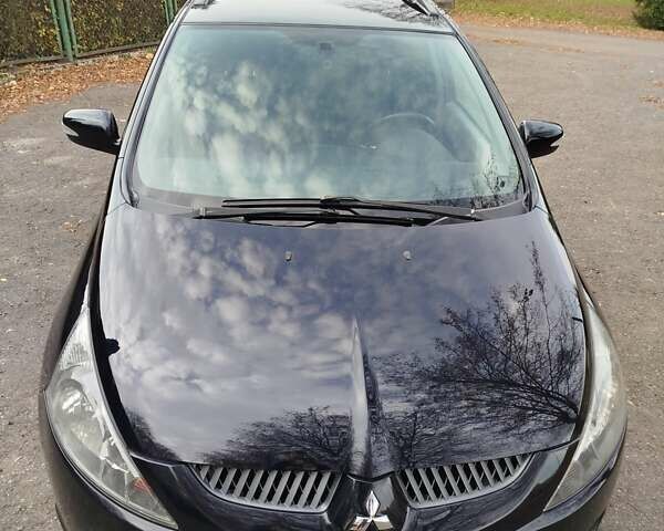 Черный Мицубиси Грандис, объемом двигателя 2.38 л и пробегом 215 тыс. км за 5900 $, фото 10 на Automoto.ua