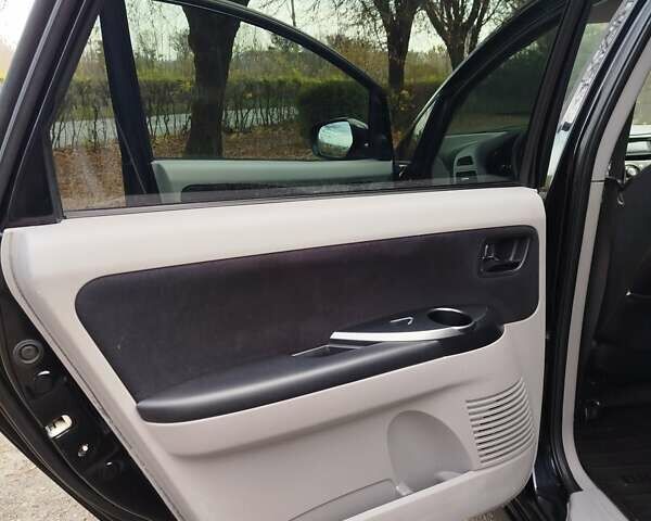 Черный Мицубиси Грандис, объемом двигателя 2.38 л и пробегом 215 тыс. км за 5900 $, фото 14 на Automoto.ua