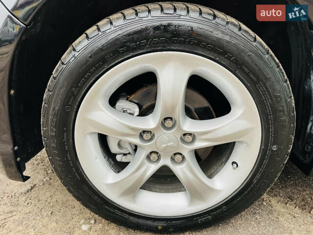 Черный Мицубиси Грандис, объемом двигателя 2.4 л и пробегом 188 тыс. км за 6800 $, фото 22 на Automoto.ua