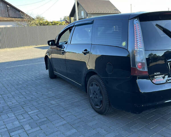 Черный Мицубиси Грандис, объемом двигателя 2.4 л и пробегом 290 тыс. км за 4600 $, фото 4 на Automoto.ua