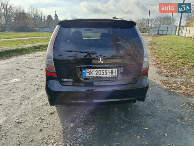 Черный Мицубиси Грандис, объемом двигателя 2 л и пробегом 249 тыс. км за 5350 $, фото 2 на Automoto.ua
