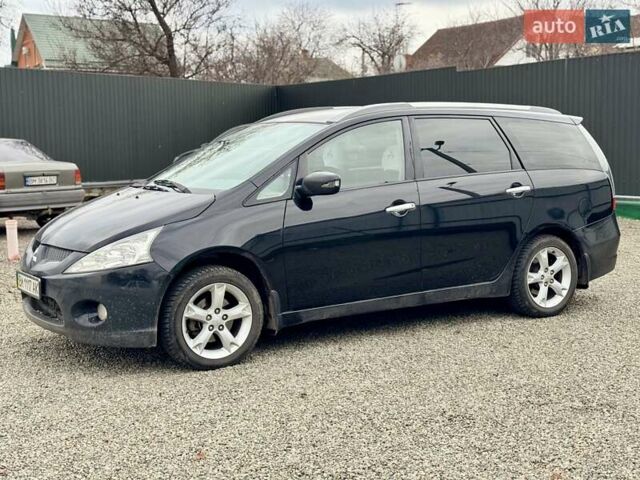 Черный Мицубиси Грандис, объемом двигателя 2.4 л и пробегом 185 тыс. км за 5899 $, фото 1 на Automoto.ua
