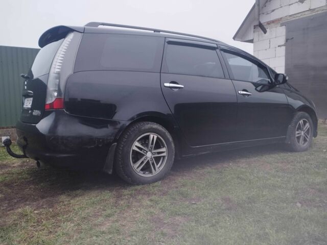 Черный Мицубиси Грандис, объемом двигателя 2.4 л и пробегом 340 тыс. км за 55000 $, фото 2 на Automoto.ua