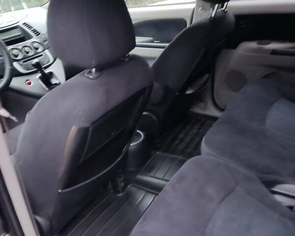 Чорний Міцубісі Грандіс, об'ємом двигуна 2.4 л та пробігом 235 тис. км за 5999 $, фото 28 на Automoto.ua