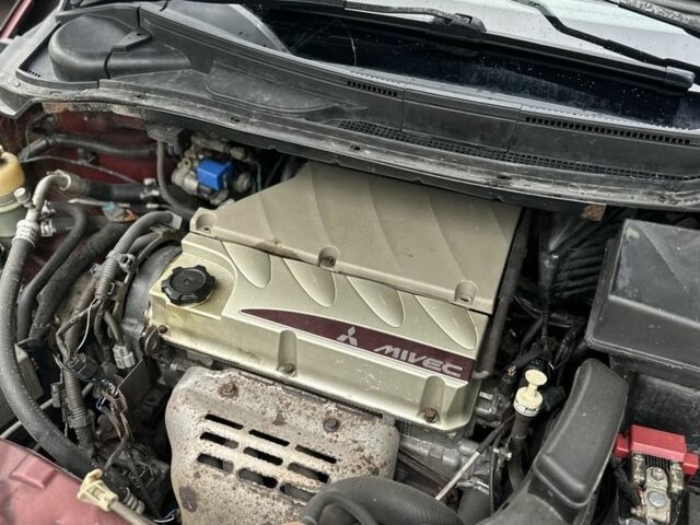 Красный Мицубиси Грандис, объемом двигателя 2.4 л и пробегом 300 тыс. км за 4850 $, фото 12 на Automoto.ua