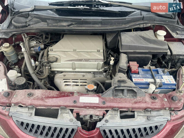 Красный Мицубиси Грандис, объемом двигателя 2.38 л и пробегом 117 тыс. км за 6999 $, фото 5 на Automoto.ua