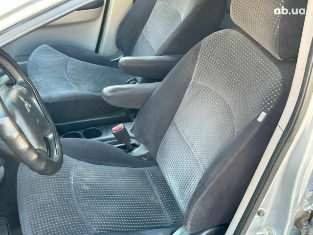 Серый Мицубиси Грандис, объемом двигателя 2.4 л и пробегом 201 тыс. км за 6990 $, фото 12 на Automoto.ua