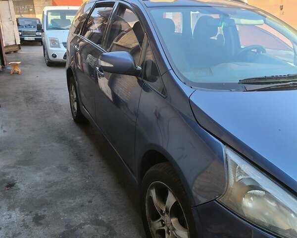 Синий Мицубиси Грандис, объемом двигателя 2.4 л и пробегом 380 тыс. км за 5700 $, фото 1 на Automoto.ua