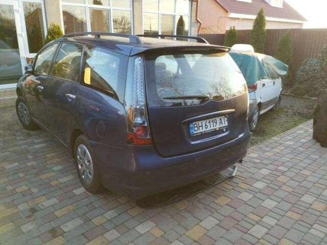 Синий Мицубиси Грандис, объемом двигателя 2.4 л и пробегом 280 тыс. км за 2700 $, фото 2 на Automoto.ua