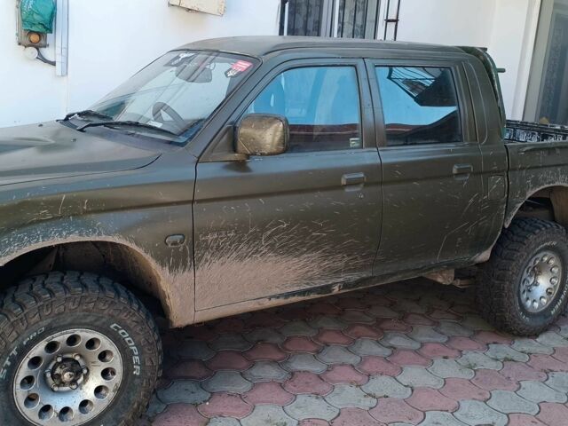 Белый Мицубиси Л 200, объемом двигателя 2.5 л и пробегом 275 тыс. км за 4700 $, фото 18 на Automoto.ua