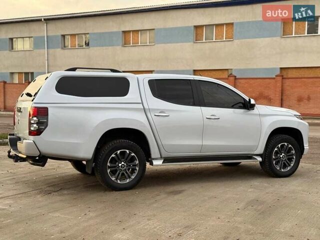 Белый Мицубиси Л 200, объемом двигателя 2.44 л и пробегом 60 тыс. км за 28500 $, фото 7 на Automoto.ua