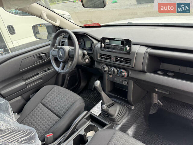 Белый Мицубиси Л 200, объемом двигателя 2.5 л и пробегом 1 тыс. км за 28962 $, фото 3 на Automoto.ua