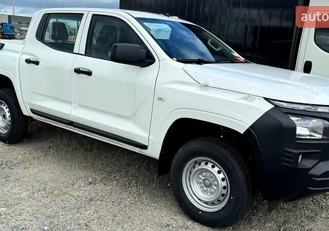 Белый Мицубиси Л 200, объемом двигателя 2.5 л и пробегом 1 тыс. км за 28962 $, фото 1 на Automoto.ua