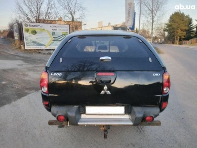 Чорний Міцубісі Л 200, об'ємом двигуна 2.5 л та пробігом 220 тис. км за 129000 $, фото 5 на Automoto.ua