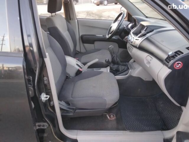 Чорний Міцубісі Л 200, об'ємом двигуна 2.5 л та пробігом 220 тис. км за 129000 $, фото 4 на Automoto.ua