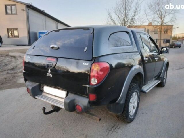 Чорний Міцубісі Л 200, об'ємом двигуна 2.5 л та пробігом 220 тис. км за 129000 $, фото 1 на Automoto.ua