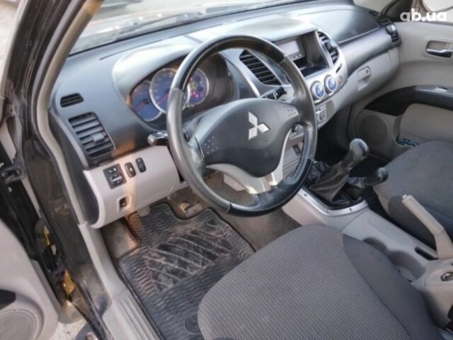 Чорний Міцубісі Л 200, об'ємом двигуна 2.5 л та пробігом 220 тис. км за 129000 $, фото 13 на Automoto.ua