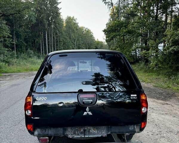 Чорний Міцубісі Л 200, об'ємом двигуна 2.5 л та пробігом 280 тис. км за 3200 $, фото 13 на Automoto.ua